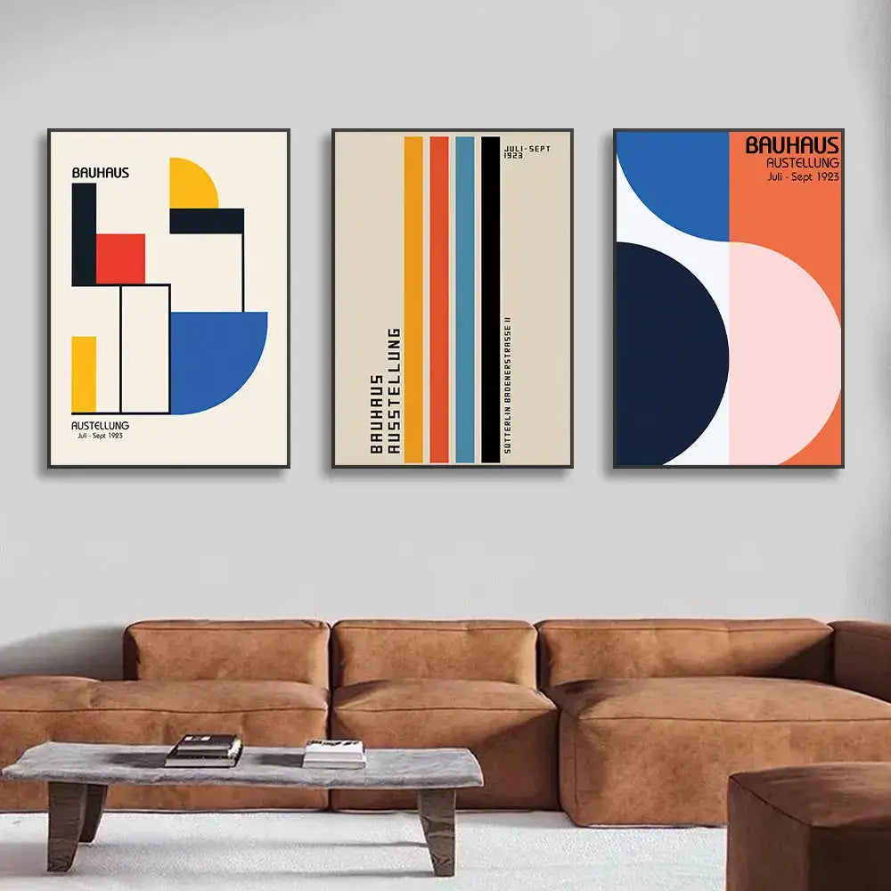 Set of three decorbites™ pop art canvas prints with bold geometric bauhaus shapes in vibrant colors on cream backgrounds