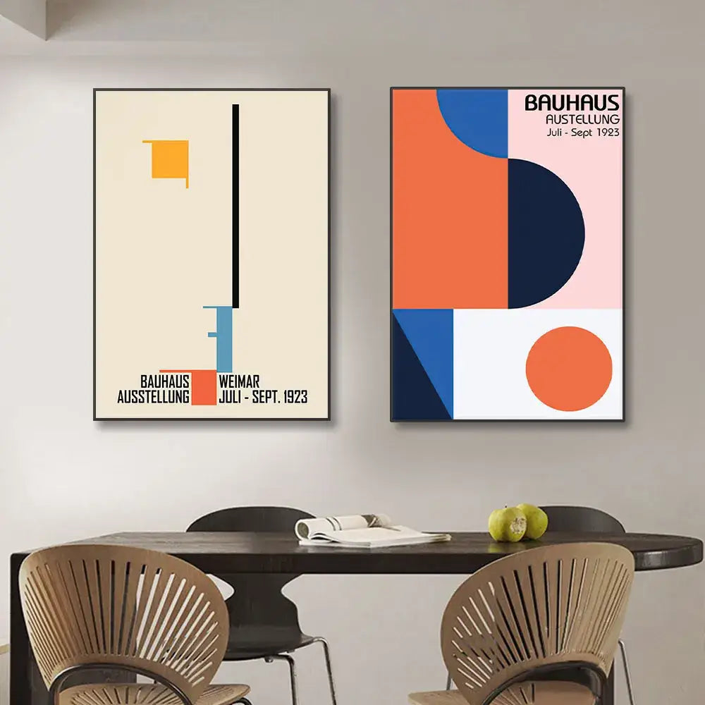 Two framed decorbites™ geometric bauhaus pop art canvas prints with bold shapes in cream, orange, blue, navy, and pink colors