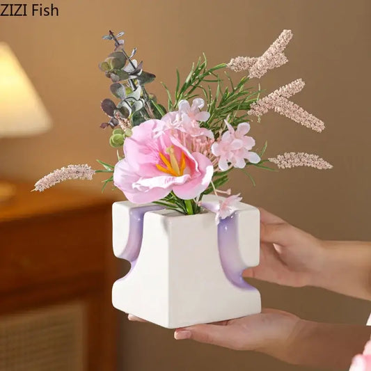 White ceramic decorbites geometric blocks vase with purple stripes holding pink and white artificial flowers for living room decor