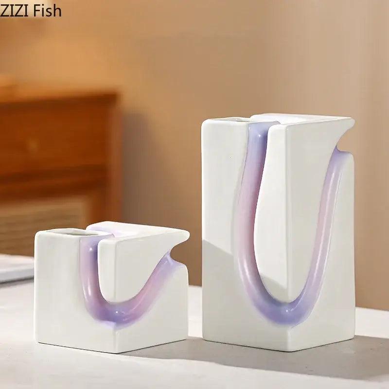 White ceramic Decorbites geometric blocks vase with sleek modern design and flowing lavender accent for living room decor