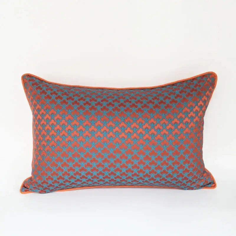Rectangular decorbites geometric blue and red jacquard waist pillow case with rust and teal quatrefoil pattern and orange piping