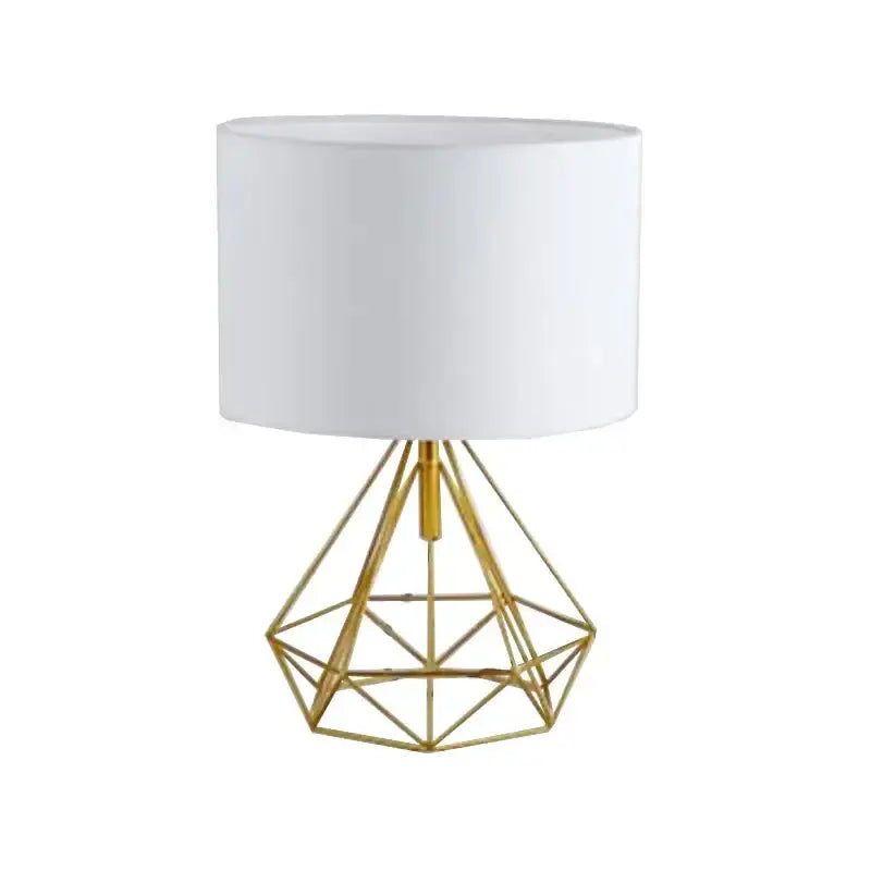 Decorbites geometric gold desk lamp with gold geometric diamond base and white cylindrical shade for bedroom use