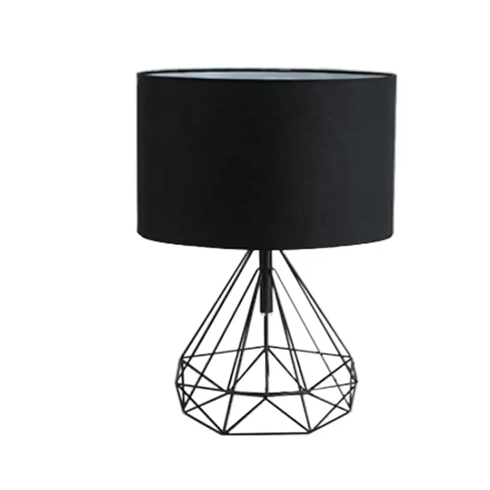 Black geometric wire table lamp with matte black cylindrical shade from decorbites geometric gold desk collection