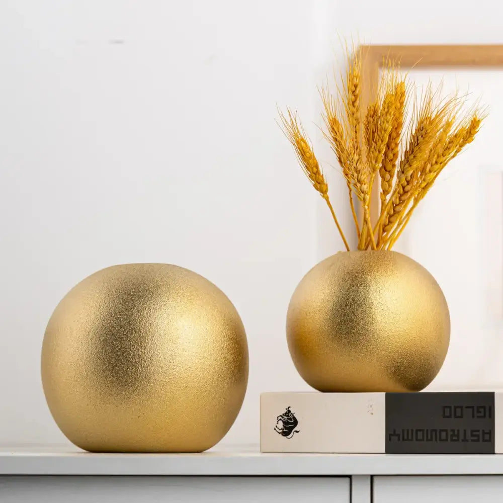 Decorbites geometric gold spherical ceramic vase with matte textured finish holding dried wheat stalks for living room decor