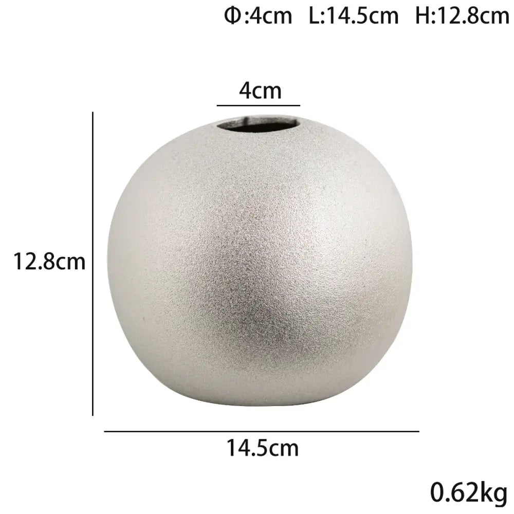 A sleek matte silver ceramic vase with a rounded tapered shape from decorbites geometric gold spherical vases collection