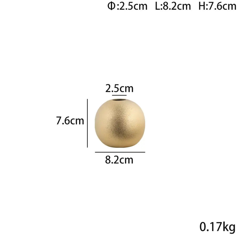 A matte gold spherical ceramic vase with a small opening from decorbites geometric gold collection for living room decor