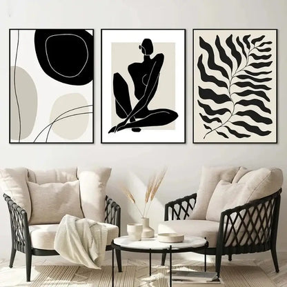 Three minimalist black and white boho canvas prints featuring geometric leaf rainbow shapes framed in thin black frames