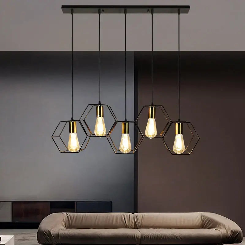 Modern hexagonal decorbites geometric led chandelier with black and brass finish and exposed filament bulbs for dining rooms