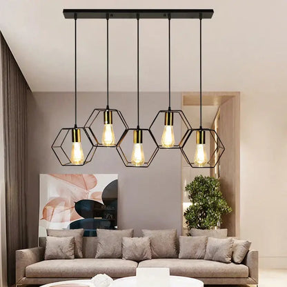 Black hexagonal metal pendant light with brass accents and exposed bulbs in the decorbites geometric led chandelier design