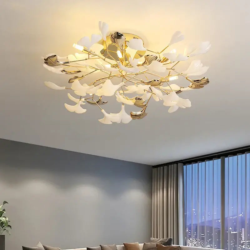 Gold-toned decorbites ginkgo leaf bedroom lamp with white petal-shaped shades in a branching floral ceiling light design