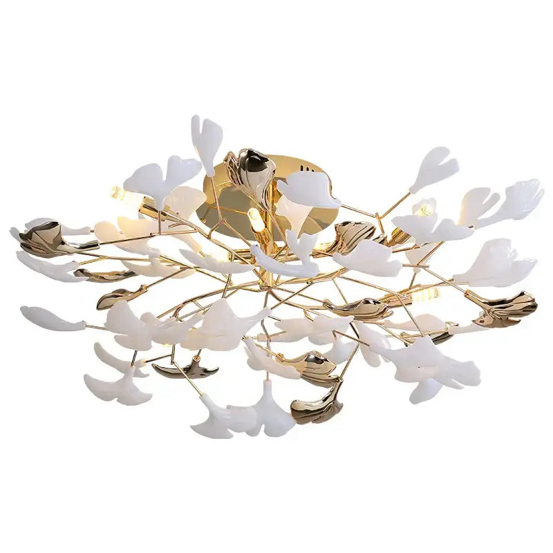 A modern ceiling light fixture with white and gold leaf accents in a branching floral design by decorbites ginkgo leaf