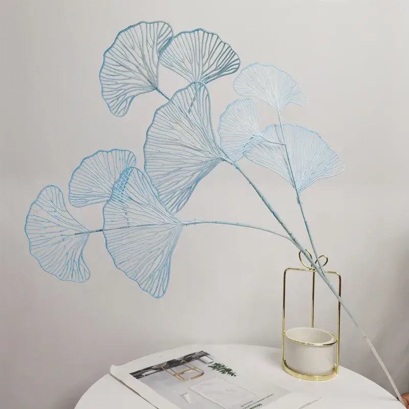 Delicate light blue artificial flowers ginkgo leaf branch in a minimalist gold-framed ceramic vase by decorbites ginkgo leaf
