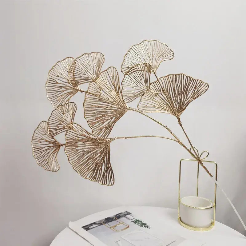 Gold-toned metal decorbites ginkgo leaf branch with intricate vein detailing artificial flowers home decor piece