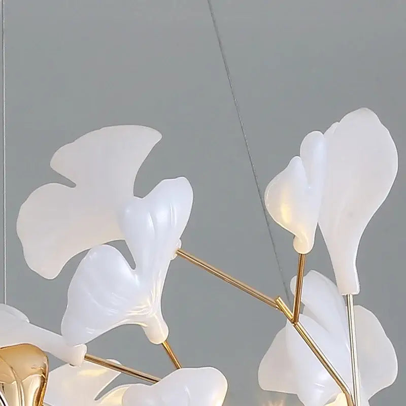 DecorBites ginkgo leaf chandelier with white translucent leaf-shaped LED lights on gold-toned metal branches