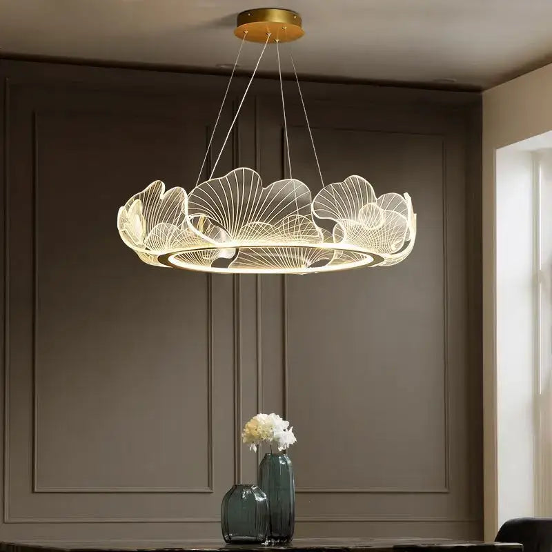 DecorBites ginkgo leaf pendant light with silver wirework features a warm glow in this ginkgo leaf chandelier design