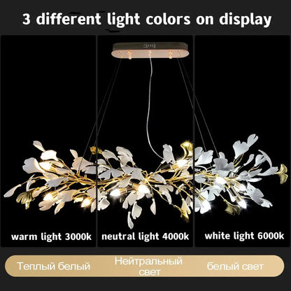 A modern gold-toned decorbites ginkgo leaf crystal chandelier with white and metallic leaf accents for home décor