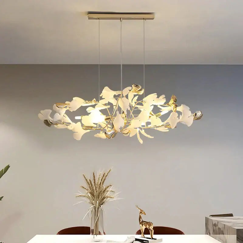 Elegant gold and white decorbites ginkgo leaf chandelier featuring a modern leaf decor design for living room lighting