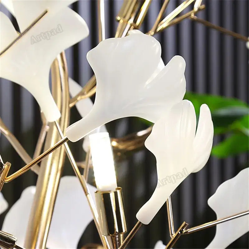 White translucent ginkgo leaf floor lamp with gold toned metal frame by decorbites for living room and bedroom use