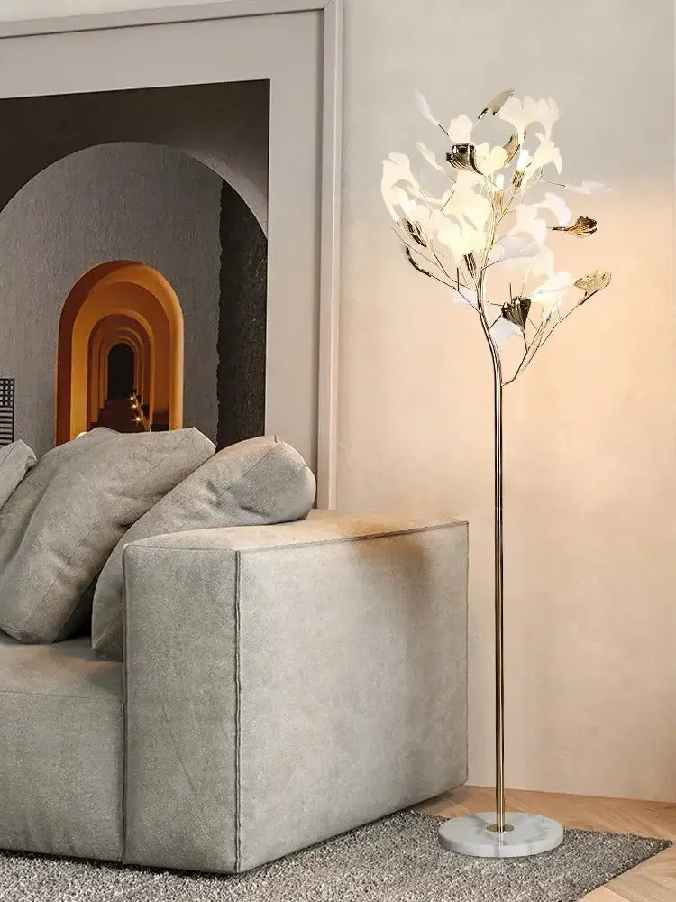 Decorbites ginkgo leaf floor lamp with metallic stem and white flower-shaped lights for modern living spaces