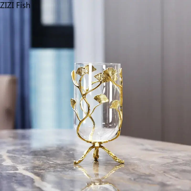 Decorbites ginkgo leaf glass vase with intricate gold leaf detailing on a three-legged golden base for desk decor