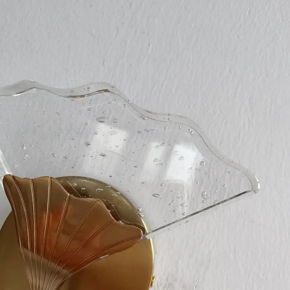 Clear wave-shaped glass shade with bubble texture on gold base in decorbites ginkgo leaf led crystal wall lights