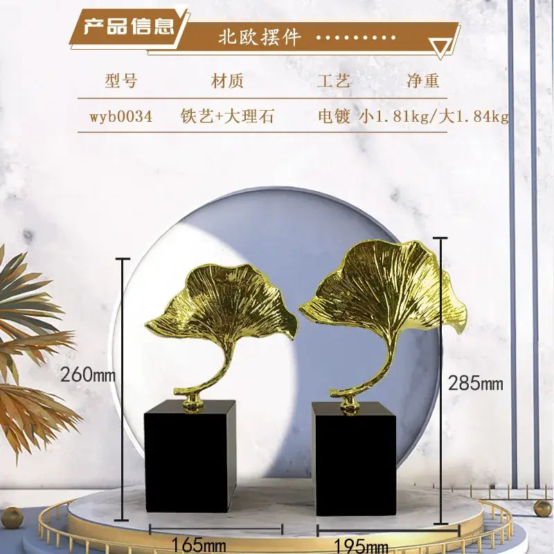 Decorbites ginkgo leaf metal sculpture features golden leaf designs with a metallic finish on black square bases
