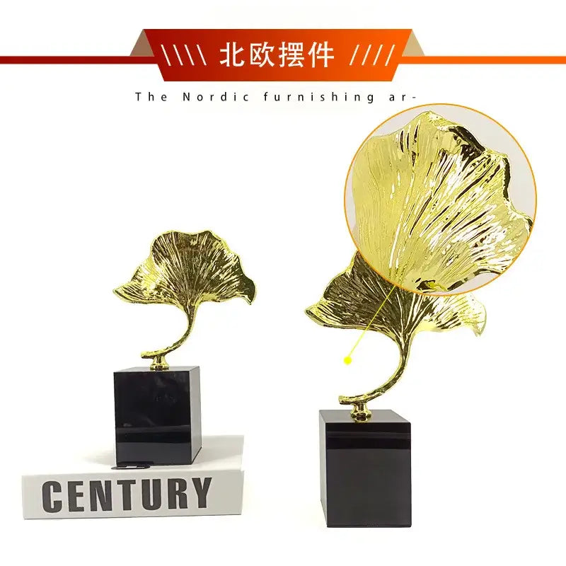 Decorbites ginkgo leaf metal sculpture featuring golden metallic ginkgo leaves with intricate veining on black bases