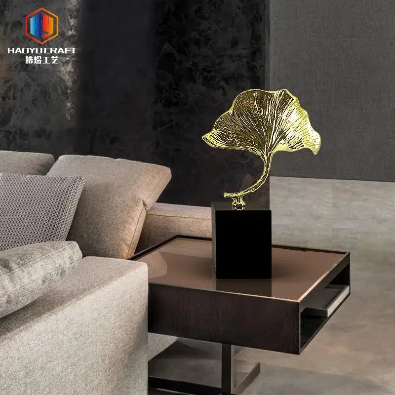 Golden metallic ginkgo leaf metal sculpture on black base by decorbites ginkgo leaf for home decor accent
