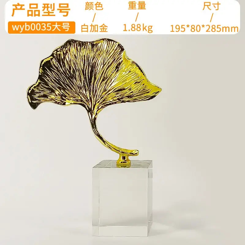 Decorbites ginkgo leaf metal sculpture featuring intricate gold vein detailing on a clear acrylic base for home decor