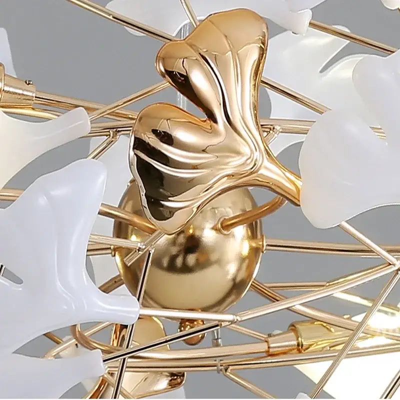Gold-colored metallic ginkgo leaf pendant chandelier with white translucent petals by decorbites for nordic decor