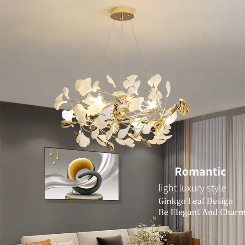 Gold-toned decorbites ginkgo leaf pendant chandelier with delicate white ginkgo leaf accents for romantic living room decor