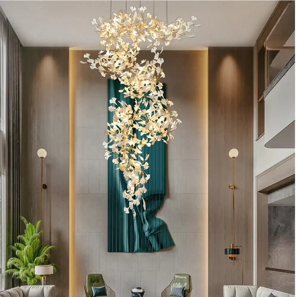 A modern decorbites ginkgo leaf pendant chandelier with white and gold floral elements for nordic romantic decor