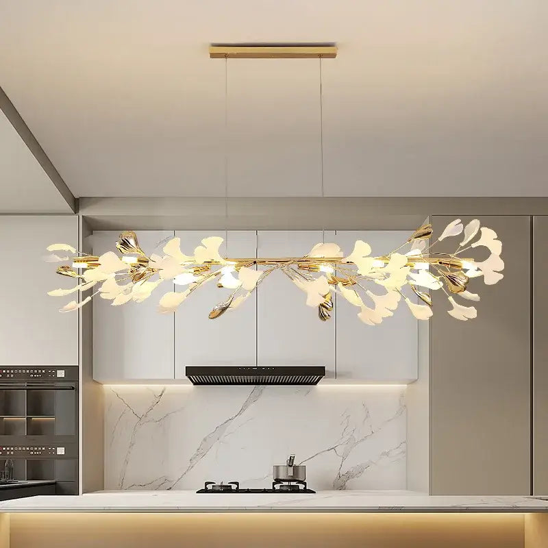 Gold-toned ginkgo leaf pendant chandelier with translucent white petals by decorbites for Nordic romantic decor