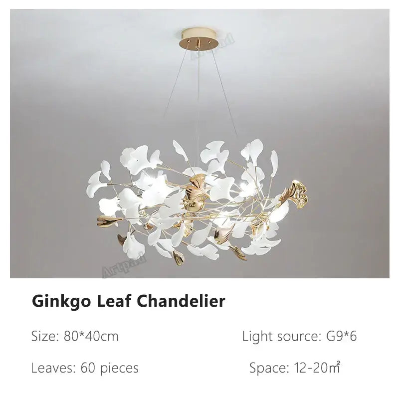 A modern decorbites ginkgo leaves chandelier with white and gold leaf components and brass fixture for luxury interiors