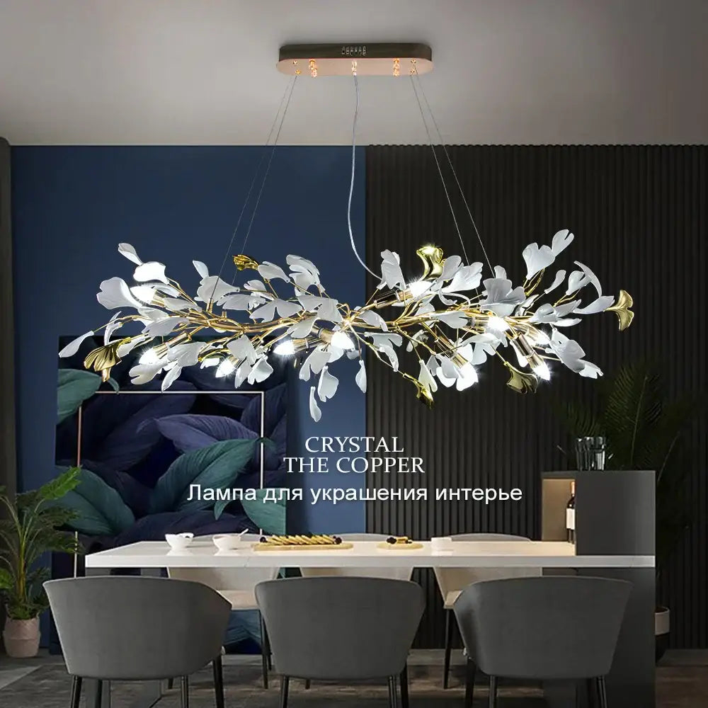 Decorbites ginkgo leaves chandelier with white and gold leaf elements on a copper ceiling fixture for luxury interiors