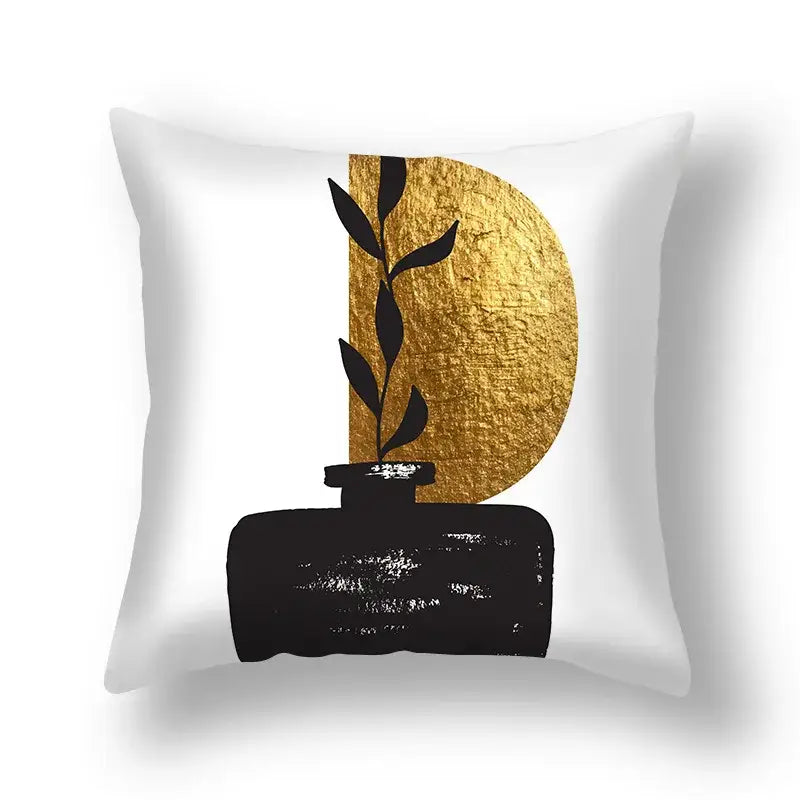 White DecorBites ginkgo leaves print throw pillow with black vase and gold textured circle for modern sofa decor