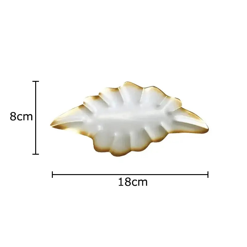 White ceramic leaf-shaped serving tray with gold-trimmed edges for decorbites ginkgo leaves wall decor