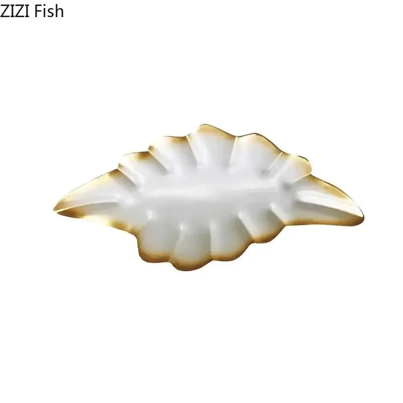 White ceramic ginkgo leaf dish with gold trim used as wall hanging ornaments for living room decor