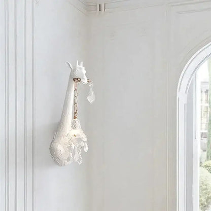 White ceramic giraffe love wall lamp with crystal accents and gold chain for bedside room decor by DecorBites™