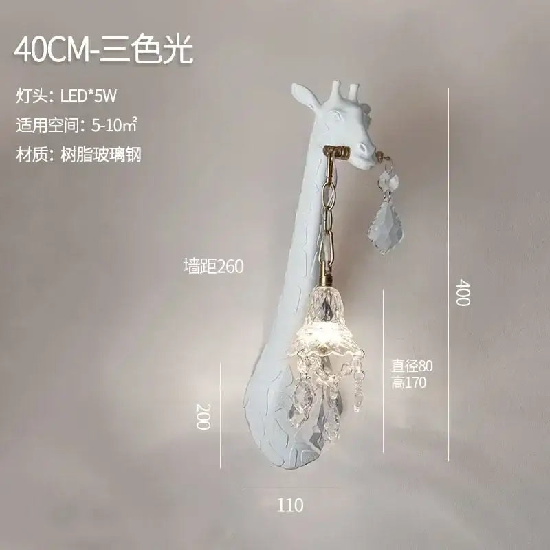White giraffe-shaped resin wall lamp with crystal chandelier pendant and brass accents for cute room decor