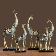 Set of five decorbites giraffe mother and child painted sculptures with gold and teal enamel on black base ornamental decor