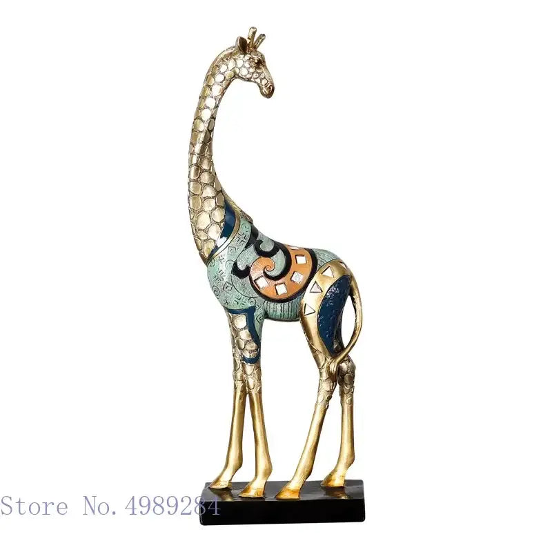 Decorbites giraffe mother and child painted sculpture features a gold-toned giraffe with intricate mosaic patterns on a black base