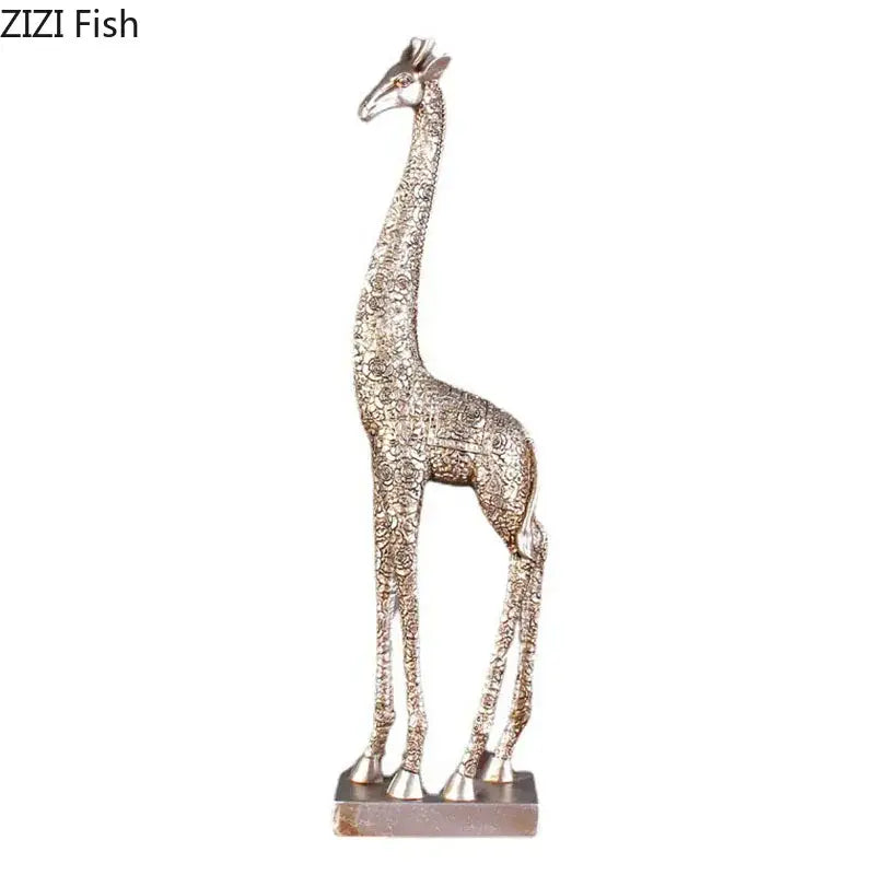 Silver-toned giraffe resin statue with intricate floral embossing and polished finish on rectangular base for decor