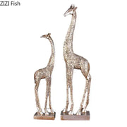 Silver-toned giraffe resin statue ornament with intricate floral embossing on rectangular bases for desk decor