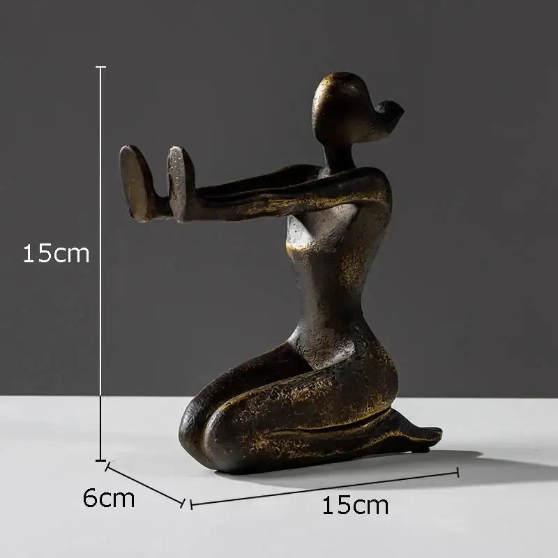Bronze-colored abstract decorbites girl statue bookends featuring a kneeling woman with elongated limbs in resin