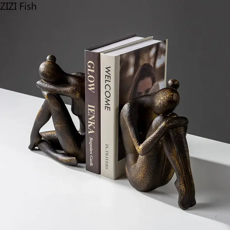 Bronze-finished resin decorbites girl statue bookends shaped as two abstract seated figures embracing for desk or bookcase