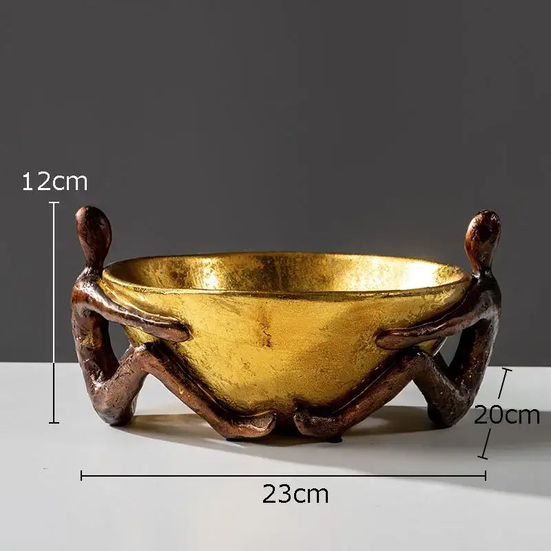 Golden bowl with sculpted metallic girl statue handles as decorbites girl statue bookends for desk or library decoration