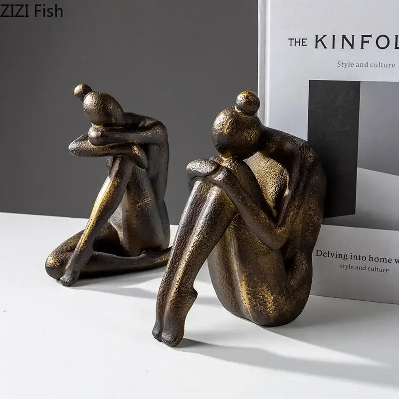 Bronze-finished decorbites girl statue bookends featuring abstract seated figurines in textured resin for desk decor
