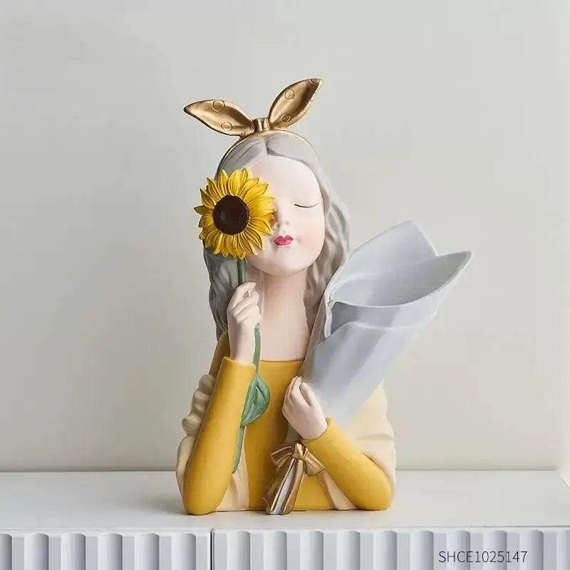 A charming decorbites girl statues resin figurine with silver hair gold bunny ears holding a yellow sunflower and bouquet