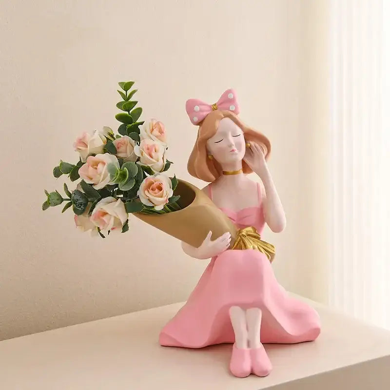 Pink resin decorbites girl statues figurine in pink dress with polka-dot bow holding gold wrapped bouquet vase ornament